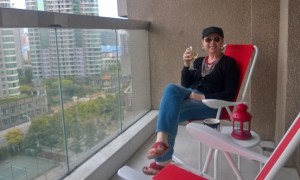 Enjoying my new patio chairs from Ikea on our balcony.