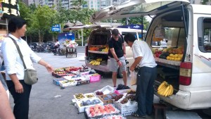Our fruit lady pointing out the best stuff to Thom
