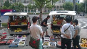 James watches as Thom picks out the fruit from our lady