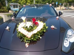 Wedding car is decked out with floral hood ornament
