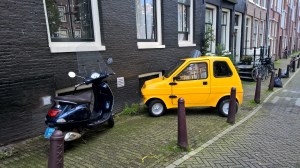 Scooter or mini car? Both have about the same room.