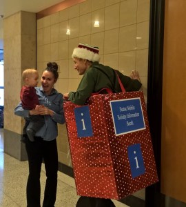 Grateful  mother to airport rolling holiday info desk dude